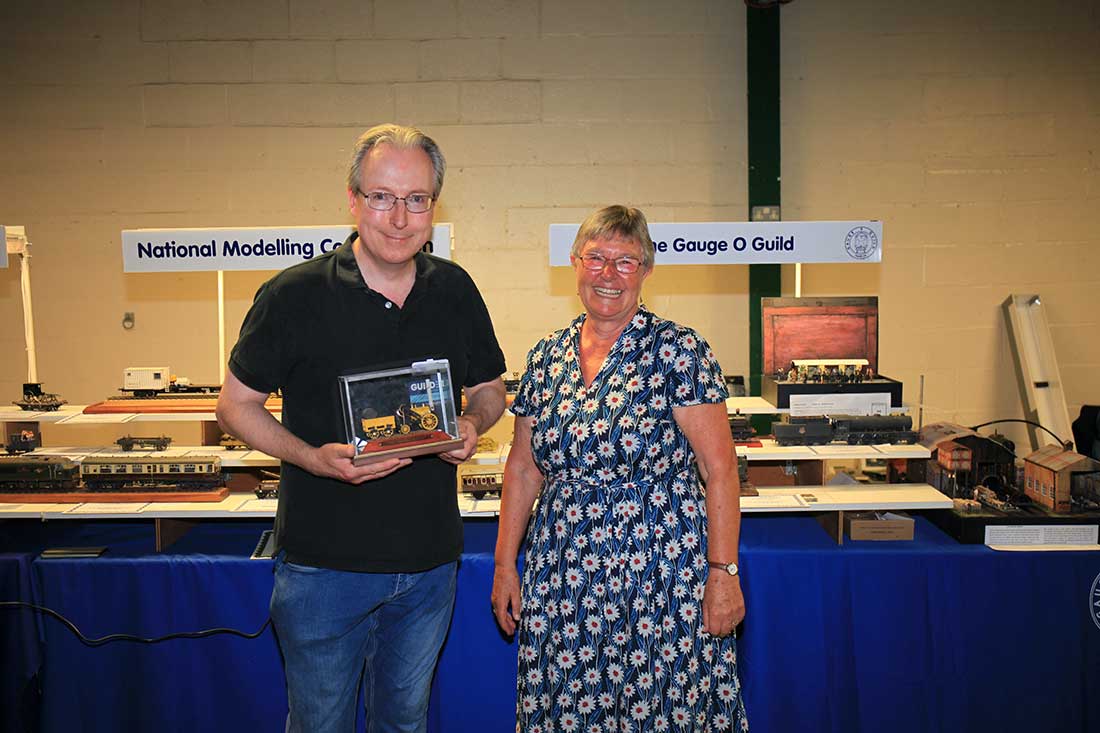 Julian Best receiving the Bob Alderman Award from Sheila Alderman